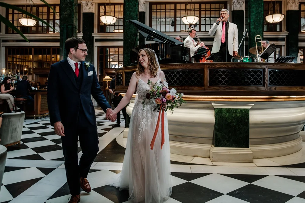 Newlyweds in the grand main hall at The Ned Hotel