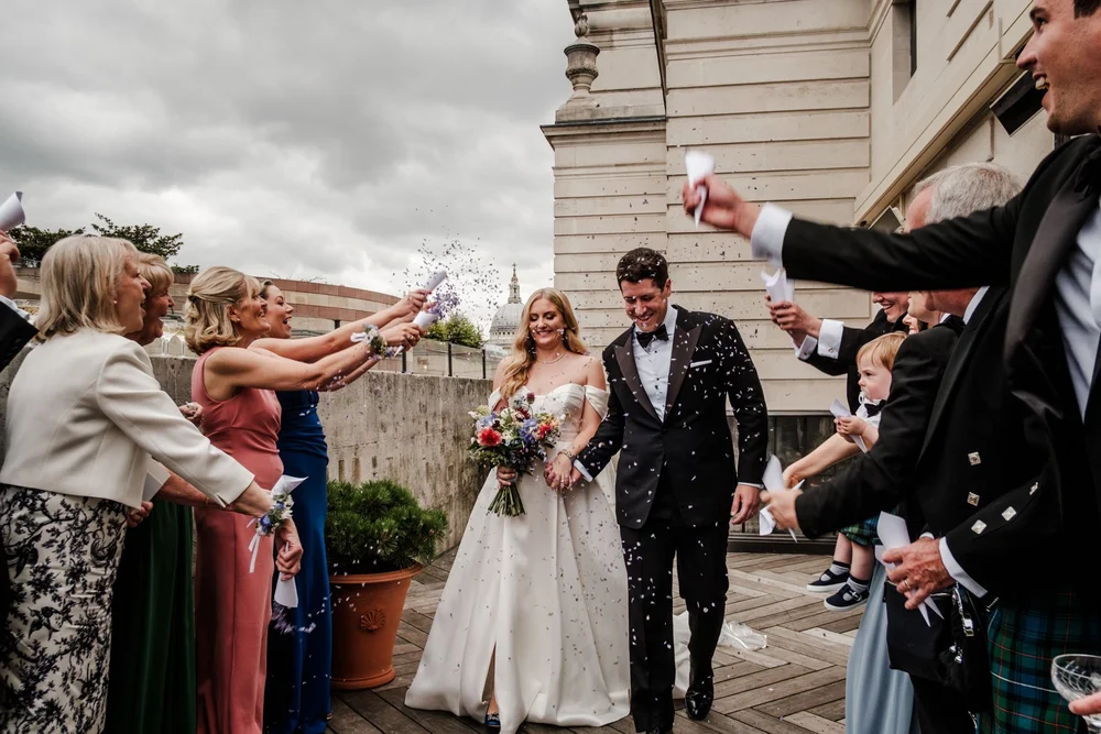 Couple during their wedding ceremony at The Ned, sharing a private smile