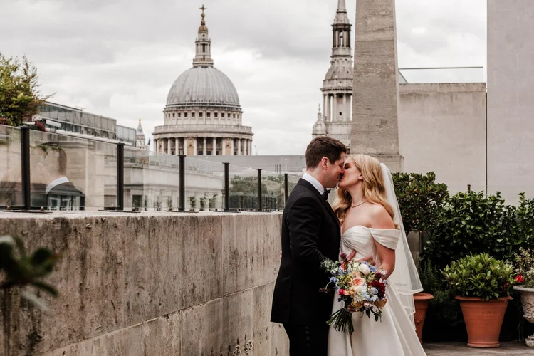 Wedding ceremony in the Tapestry Room at The Ned Hotel City of London &mdash; a Grade I listed Lutyens-designed former bank with soaring columns and ornate stonework, photographed by Oliver Holder