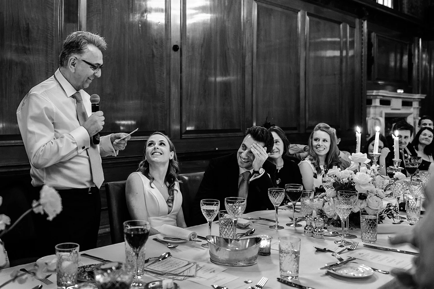 Bridesmaids and groom laughing on the terrace at The Ned Hotel