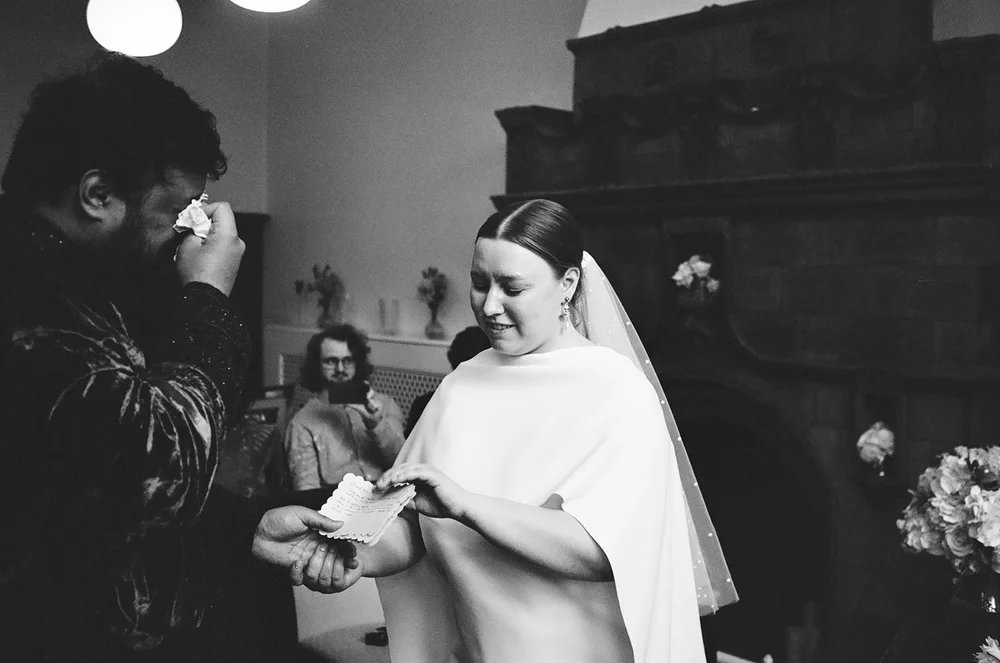 Bride having her veil adjusted before the ceremony, shot on 35mm film