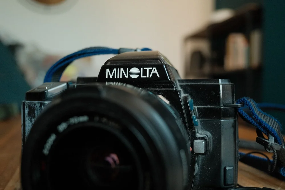 Minolta 35mm film camera on a bar at a wedding