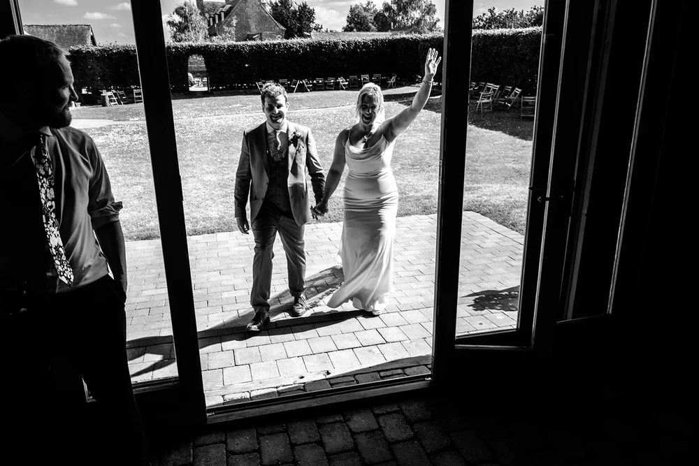 Rose and Frankie entering the barn for their wedding breakfast