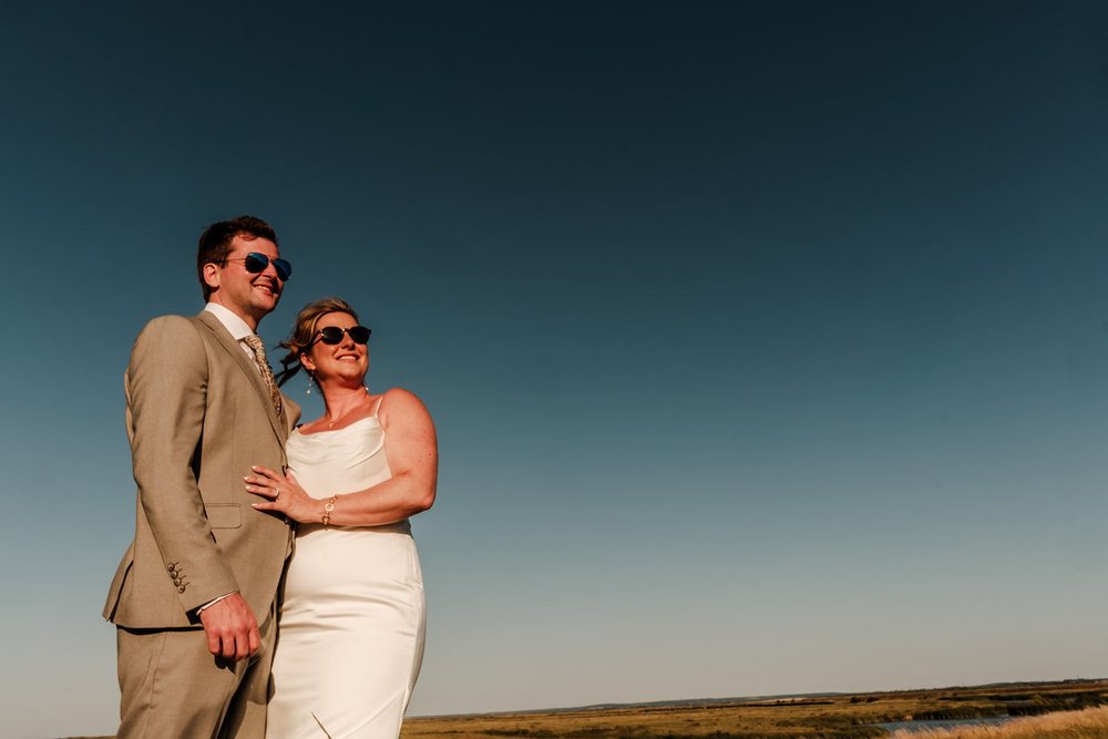 Rose and Frankie against the big Sheppey sky at golden hour