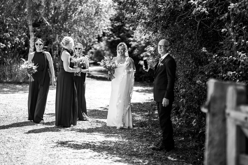 Rose and her father waiting to walk to the outdoor ceremony at Elmley