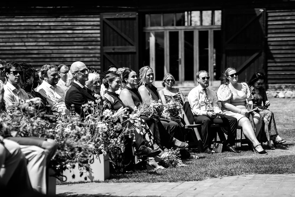Guests seated outside the barn for the ceremony at Elmley Nature Reserve