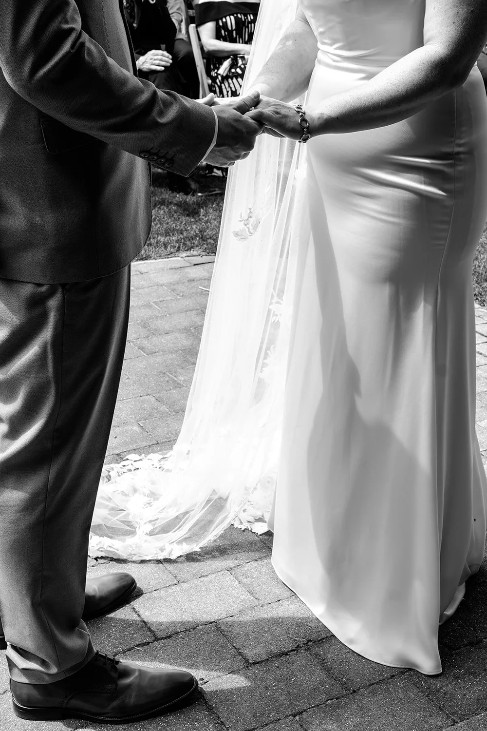 Rose&rsquo;s dress and veil being straightened before the ceremony