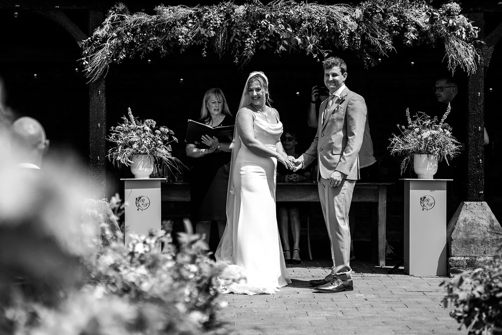 Rose and Frankie&rsquo;s outdoor ceremony under the greenery at Elmley