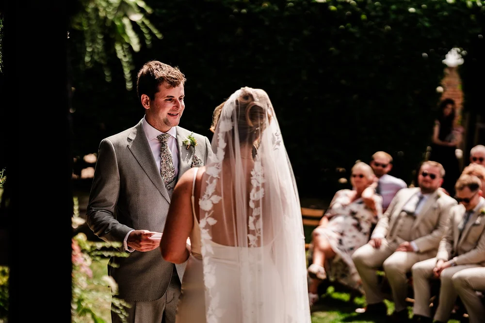 Rose walking down the aisle in her veil at Elmley Nature Reserve