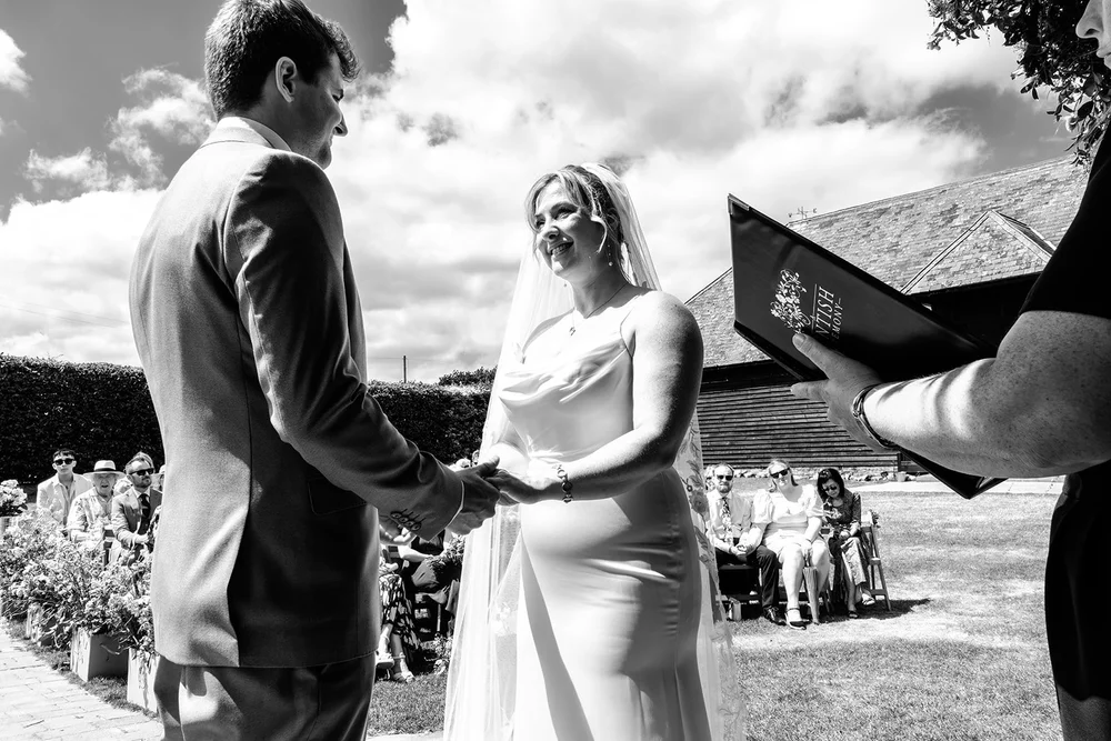 Exchanging rings at the outdoor ceremony at Elmley Nature Reserve
