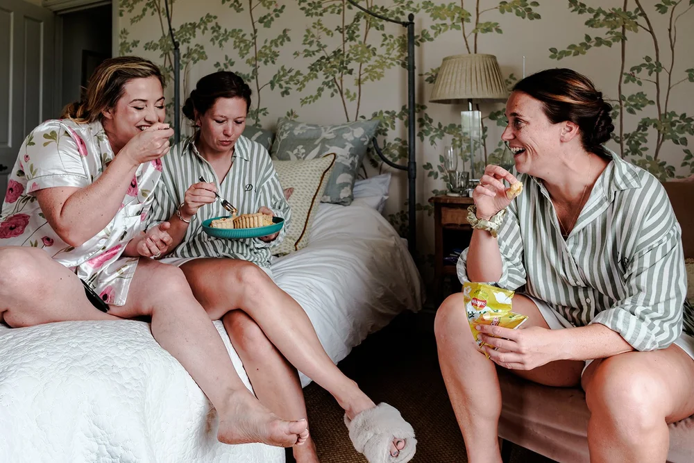 Bridesmaids on the bed before the wedding at Elmley Nature Reserve