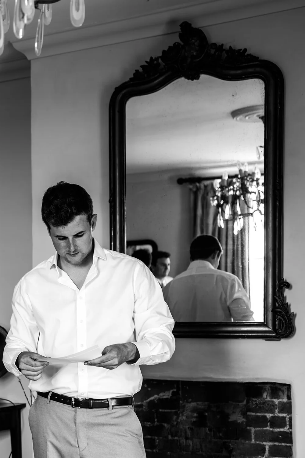 Frankie getting dressed in the mirror before his Elmley wedding
