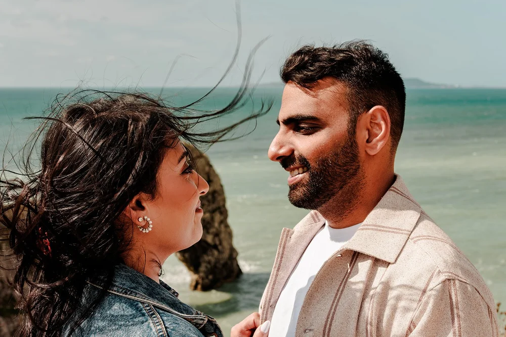 The moment of a proposal at Durdle Door on the Dorset coast