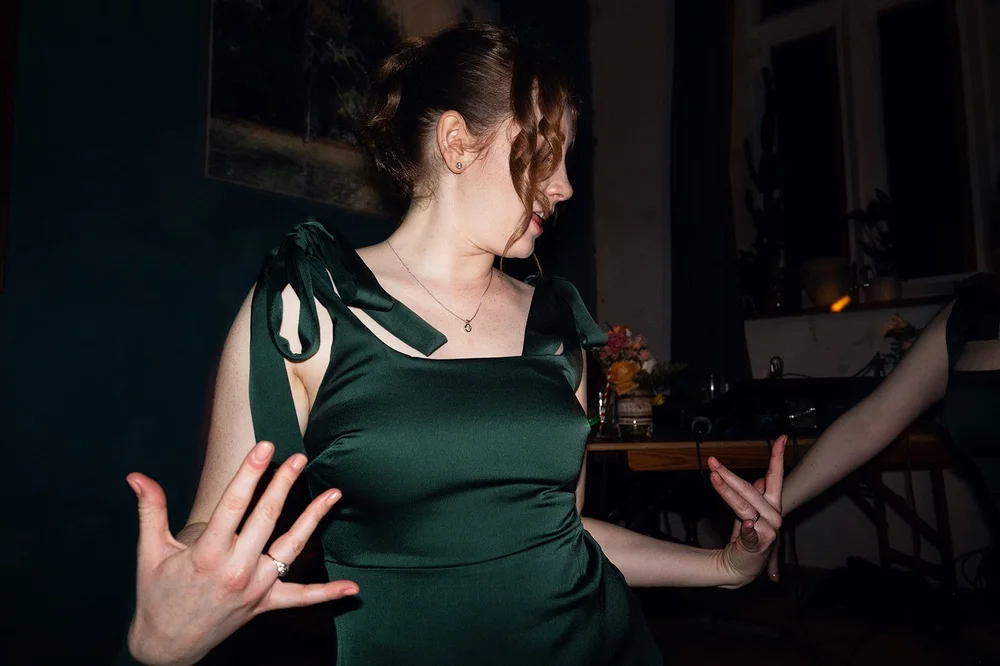A bridesmaid dancing at the evening reception, Southbank Club