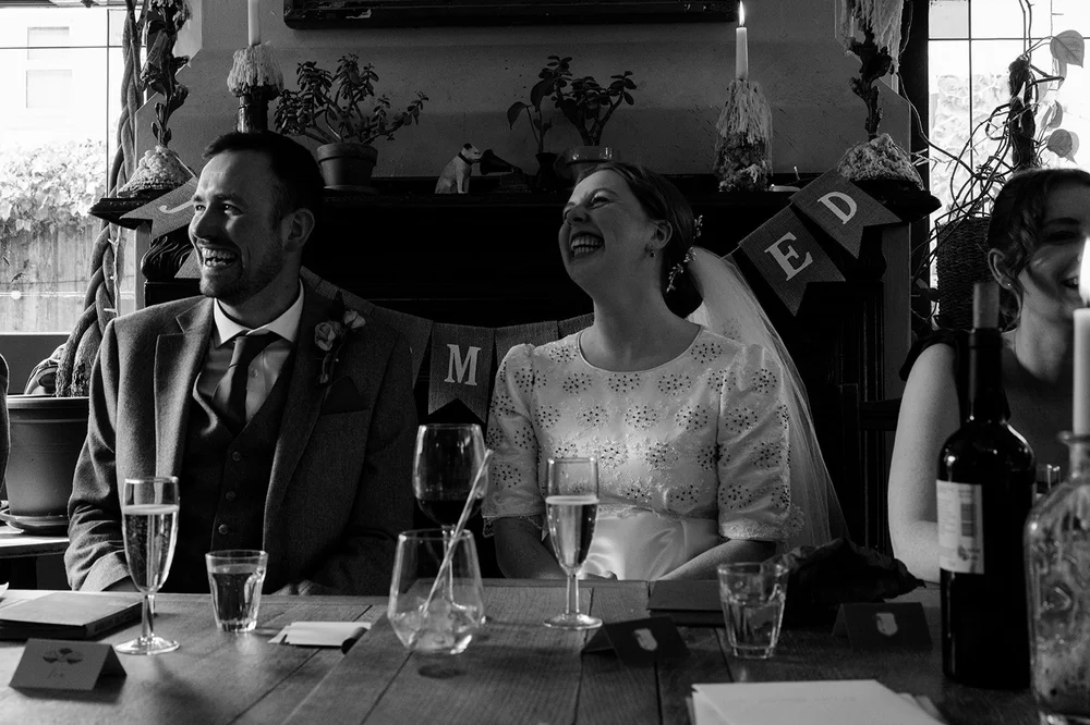 Listening to the speeches at the top table, Alma Tavern wedding