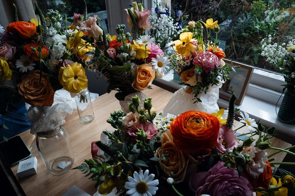 The bright spring flowers laid out before the wedding at the Alma Tavern