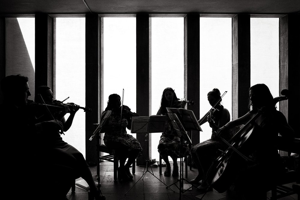 The string quartet silhouetted against the windows at All Saints, Clifton