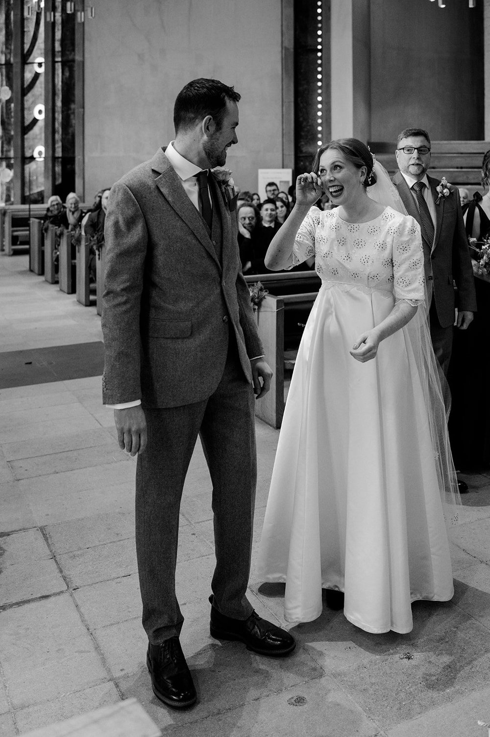 A quiet portrait of Ffion and Tom outside the church in Clifton