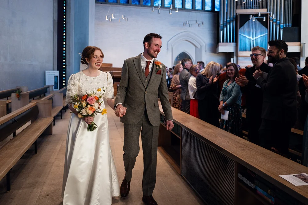 Ffion and Tom walking back down the aisle as a married couple, Clifton