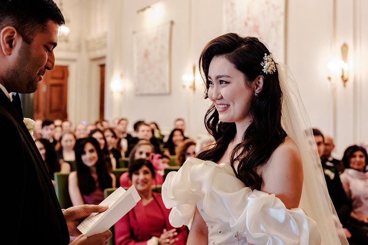 Bride laughing during her wedding ceremony at The Ned Hotel