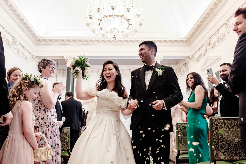Confetti as a newly married couple leave their ceremony at The Ned Hotel