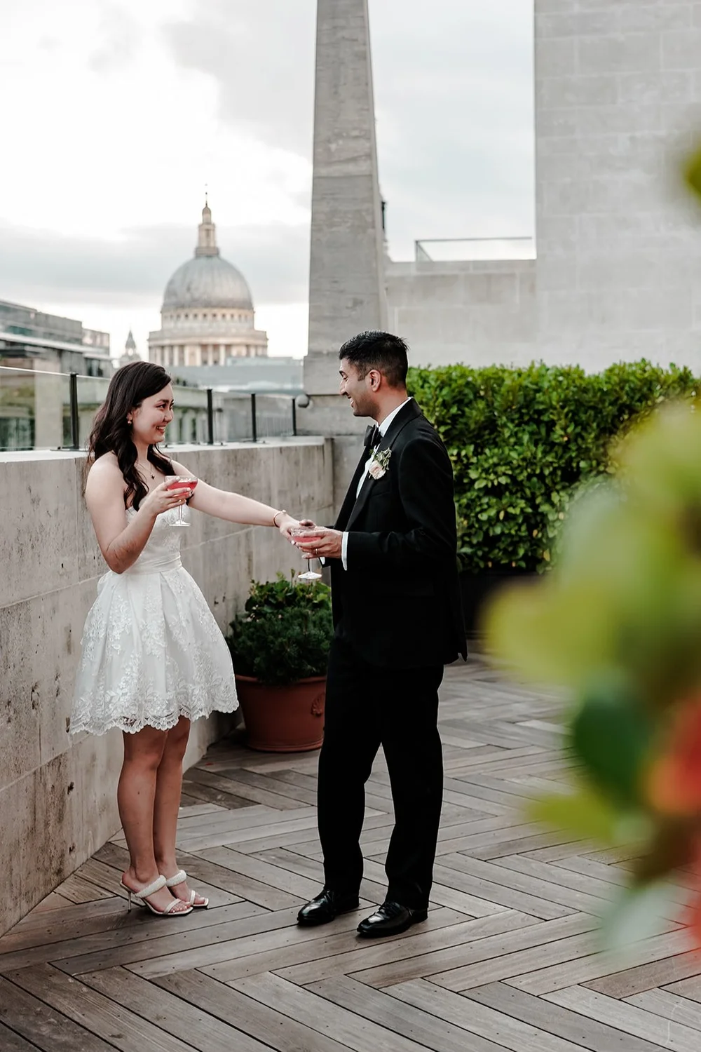 Guests on the roof terrace at The Ned with St Paul&rsquo;s Cathedral in the distance