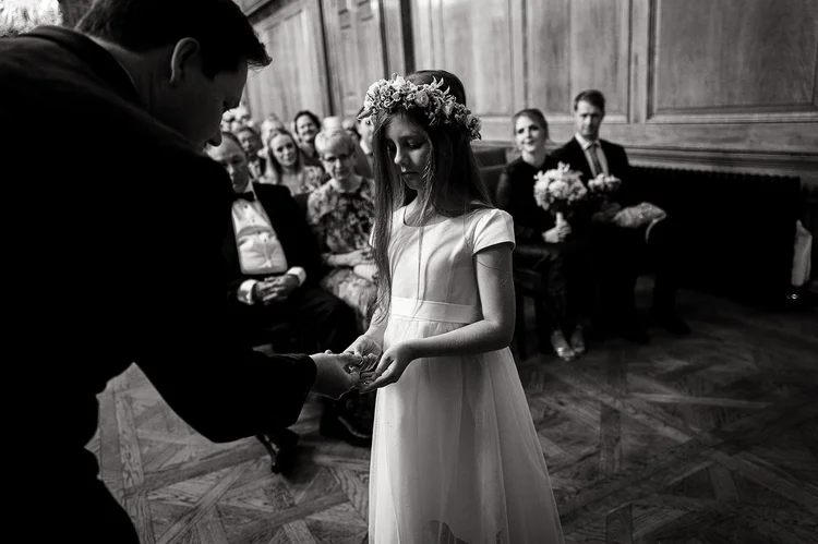 Exchanging rings during a wedding ceremony at The Ned Hotel
