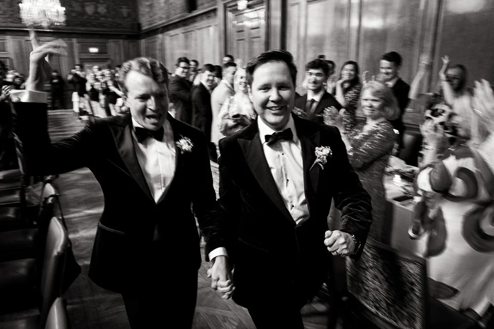 Two grooms applauded into their wedding breakfast at The Ned Hotel