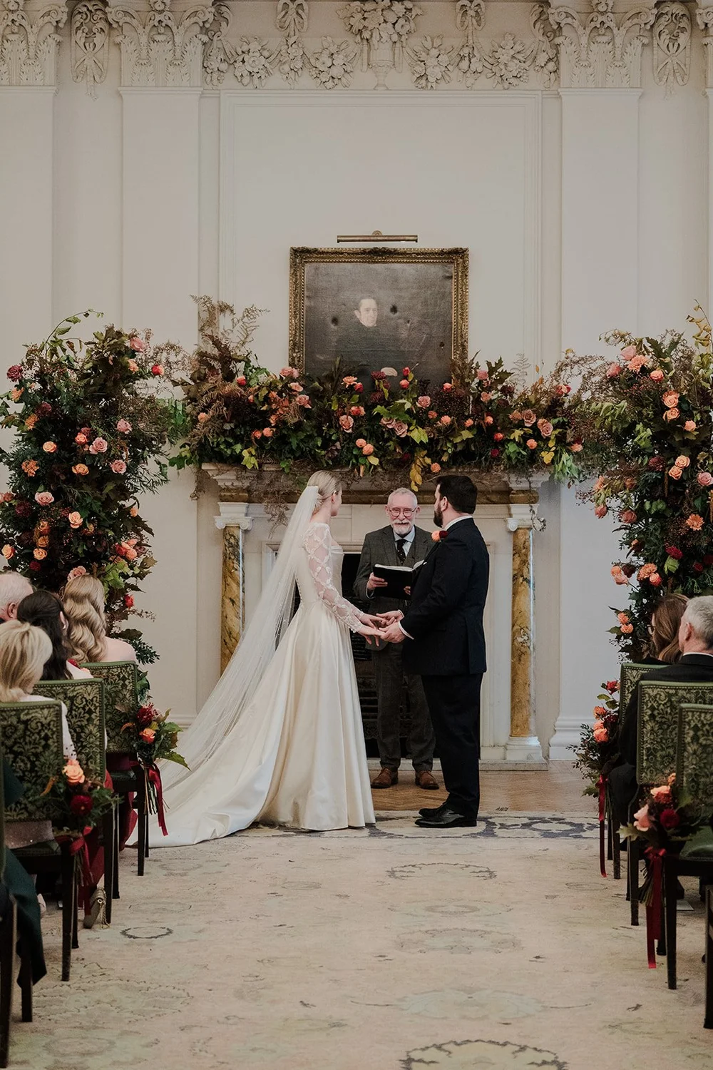 Wedding vows beneath an autumn floral arch at The Ned Hotel, London