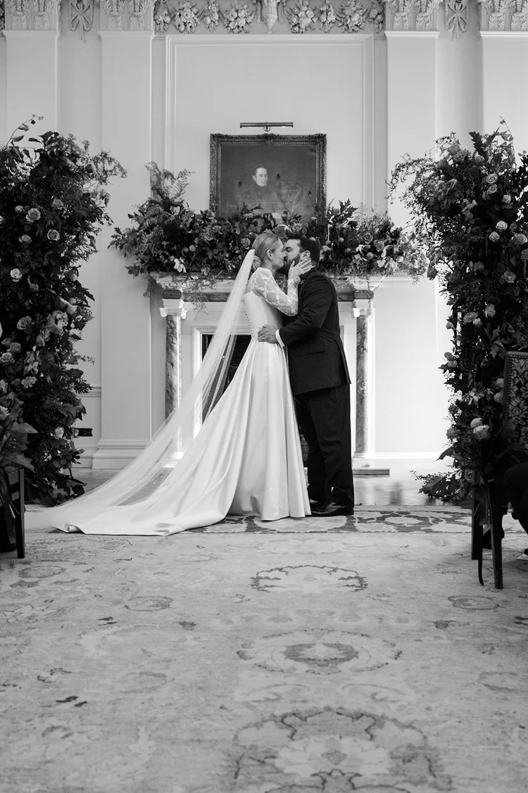 Black and white photograph of a couple&rsquo;s first kiss as newlyweds at The Ned