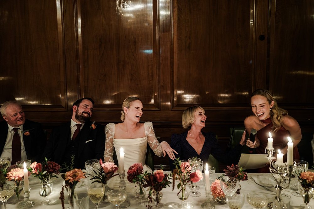 Top table laughing together during the wedding breakfast at The Ned