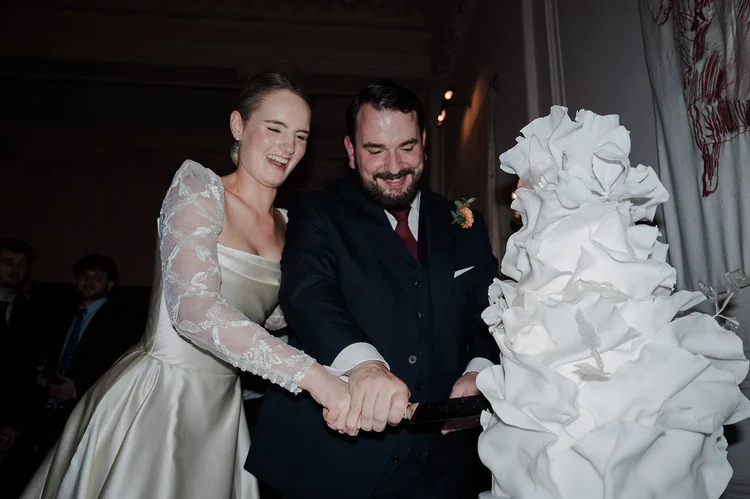 Cutting the wedding cake at The Ned Hotel, City of London