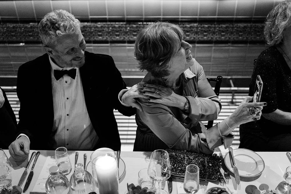 Black and white photograph of guests at dinner at The Libertine