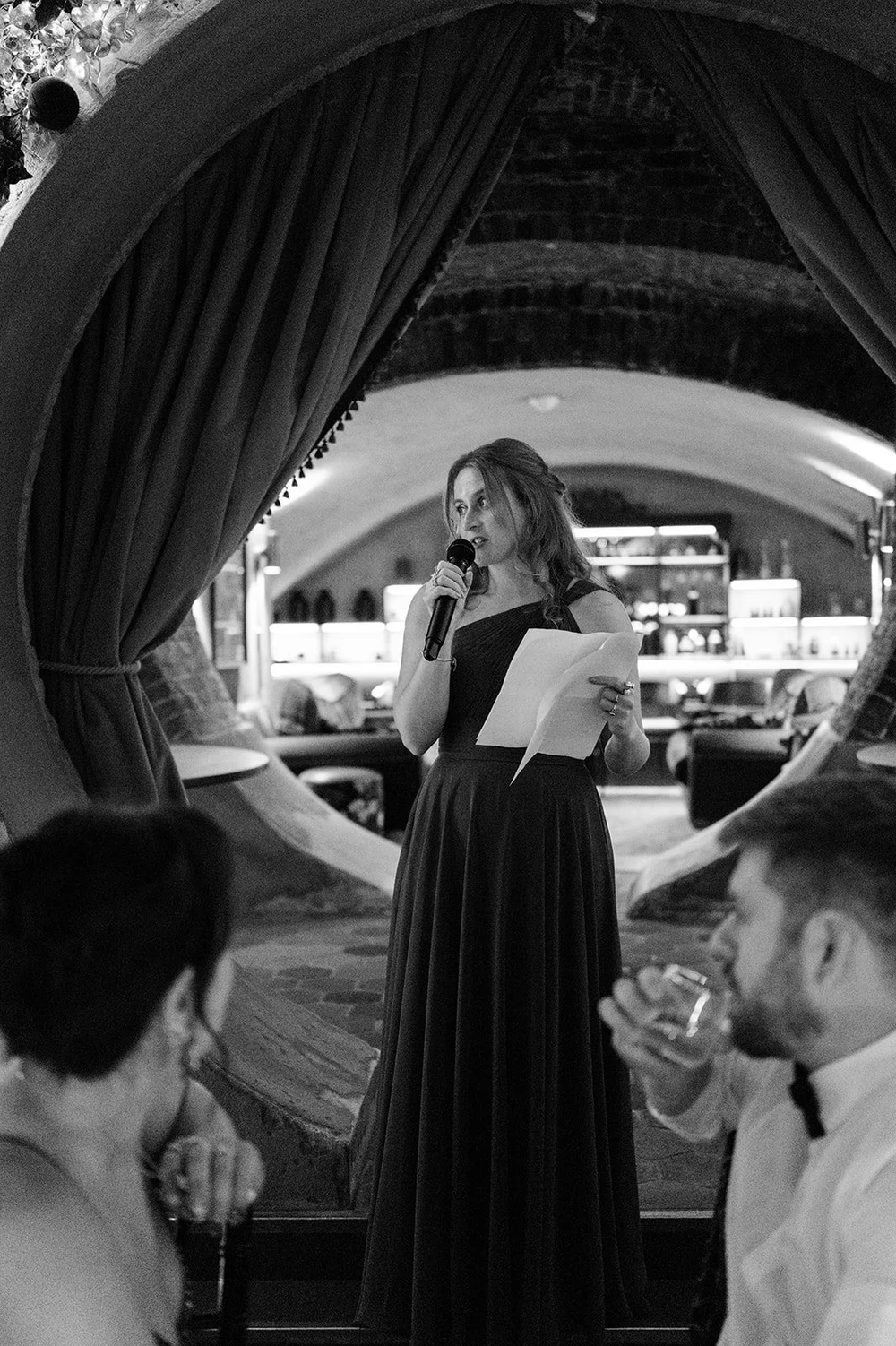 A guest speaking to the room during the wedding speeches