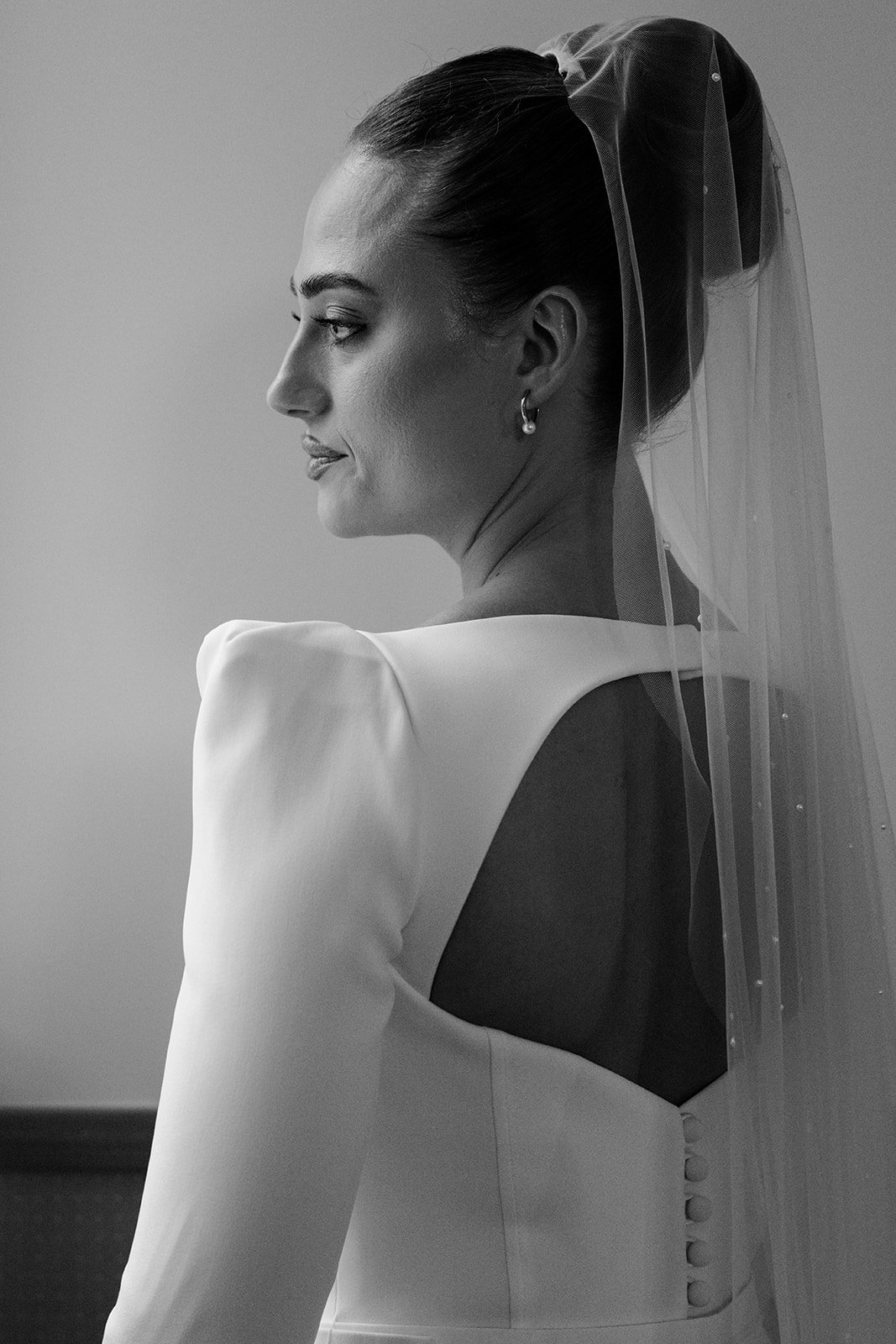 Detail of the back of Sophie&rsquo;s wedding dress and veil