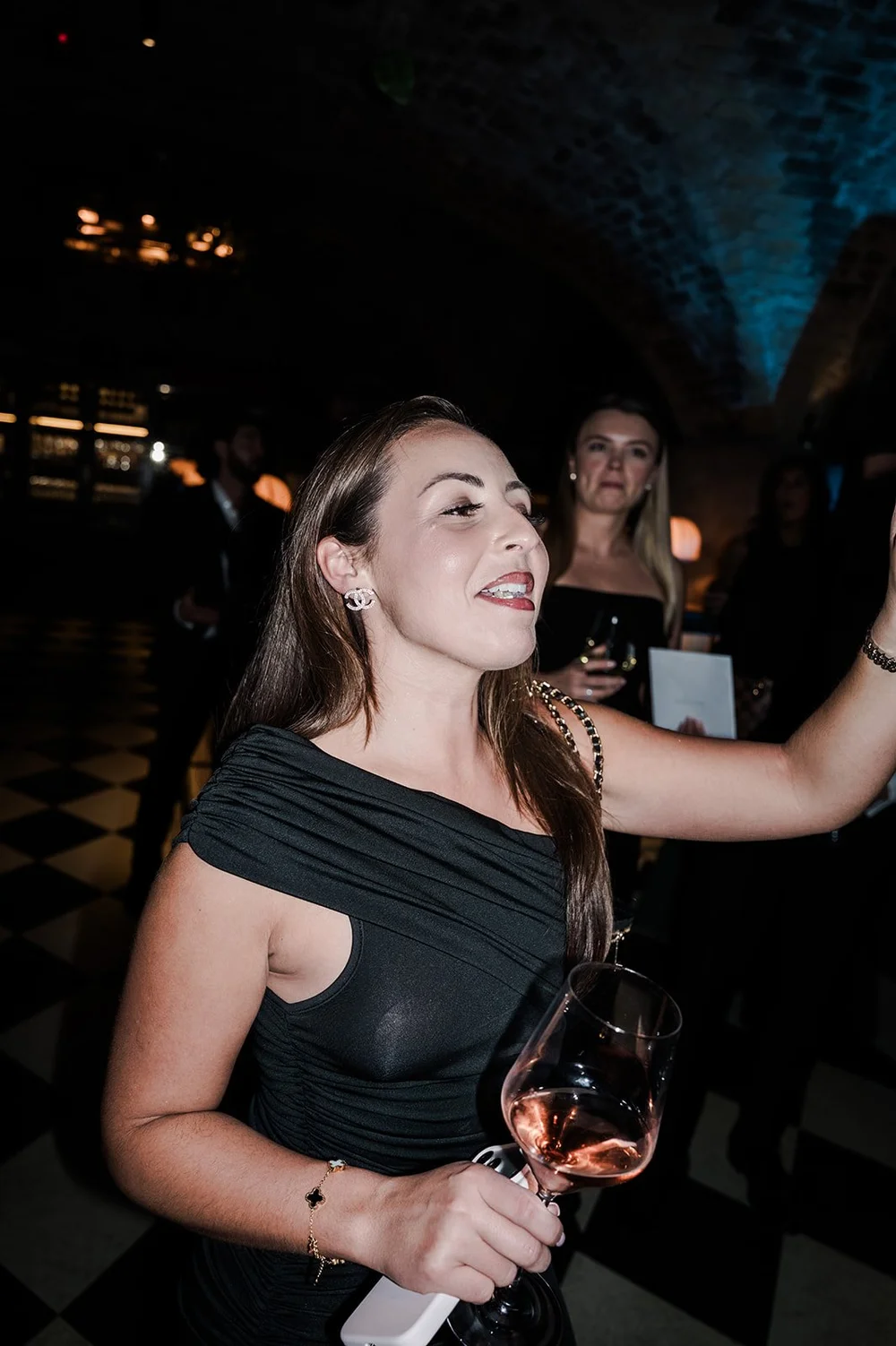 A guest with a drink at the wedding reception at The Libertine