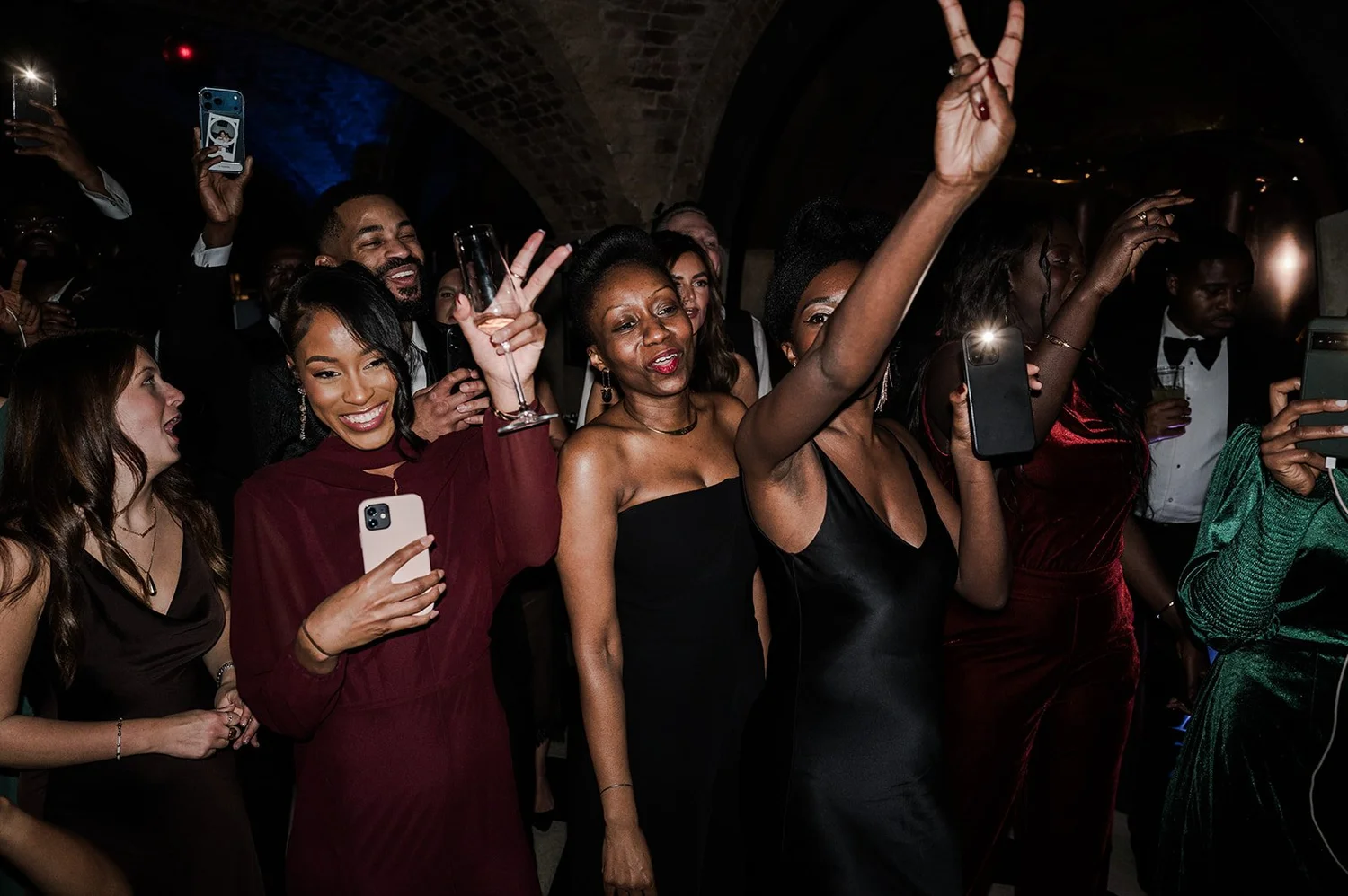 The dance floor filling up at Sophie and Dan&rsquo;s London wedding reception