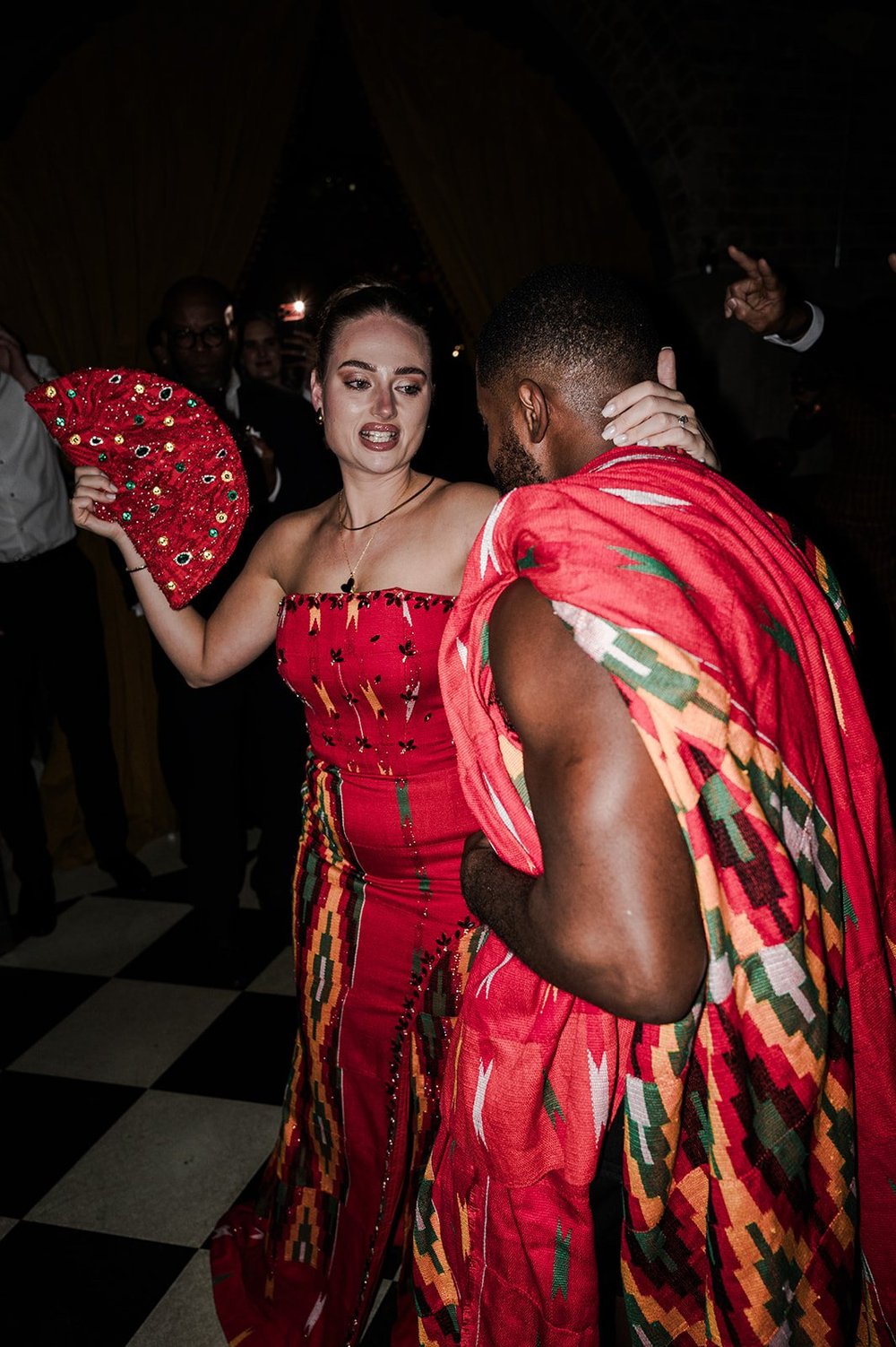Sophie and Dan dancing together in Ghanaian dress at The Libertine