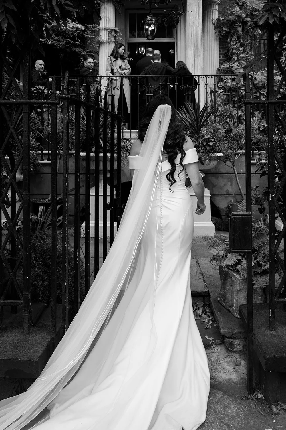 Chloe&rsquo;s veil trailing along the railings on the way to Brunswick House