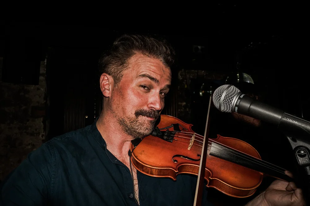 The violinist playing in the vaults at Brunswick House