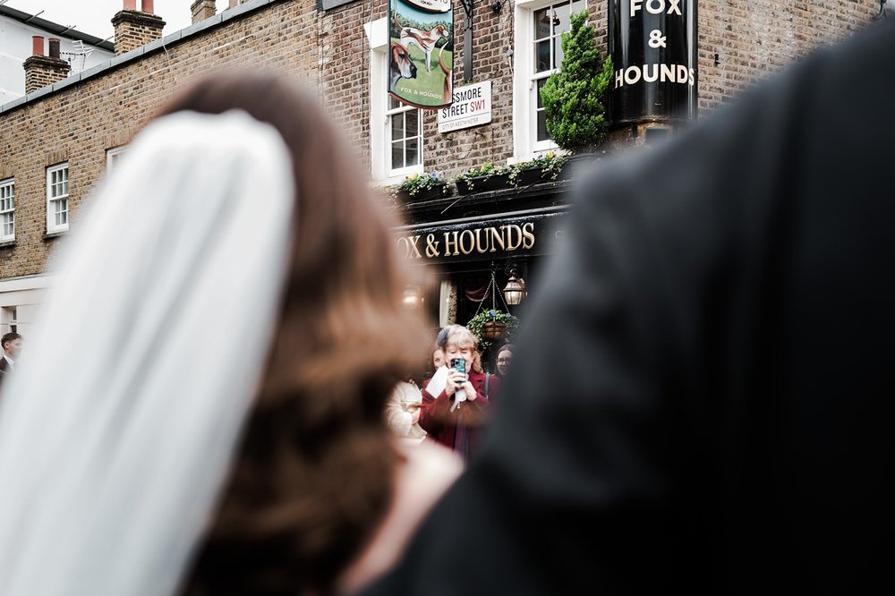 Chloe arriving at the Fox and Hounds on Passmore Street after the ceremony