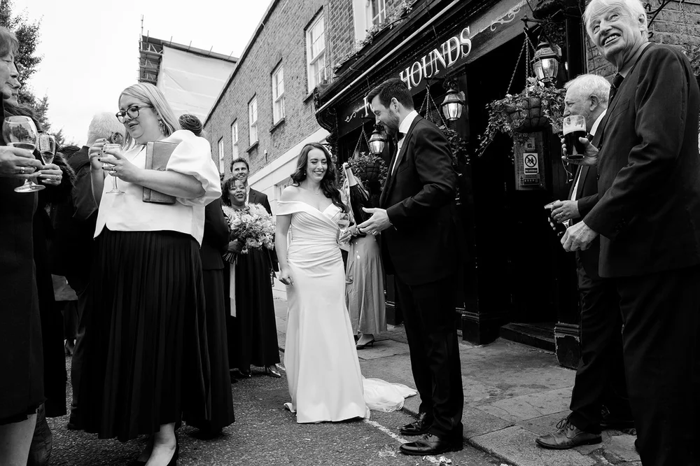Black and white photograph of guests outside the Fox and Hounds