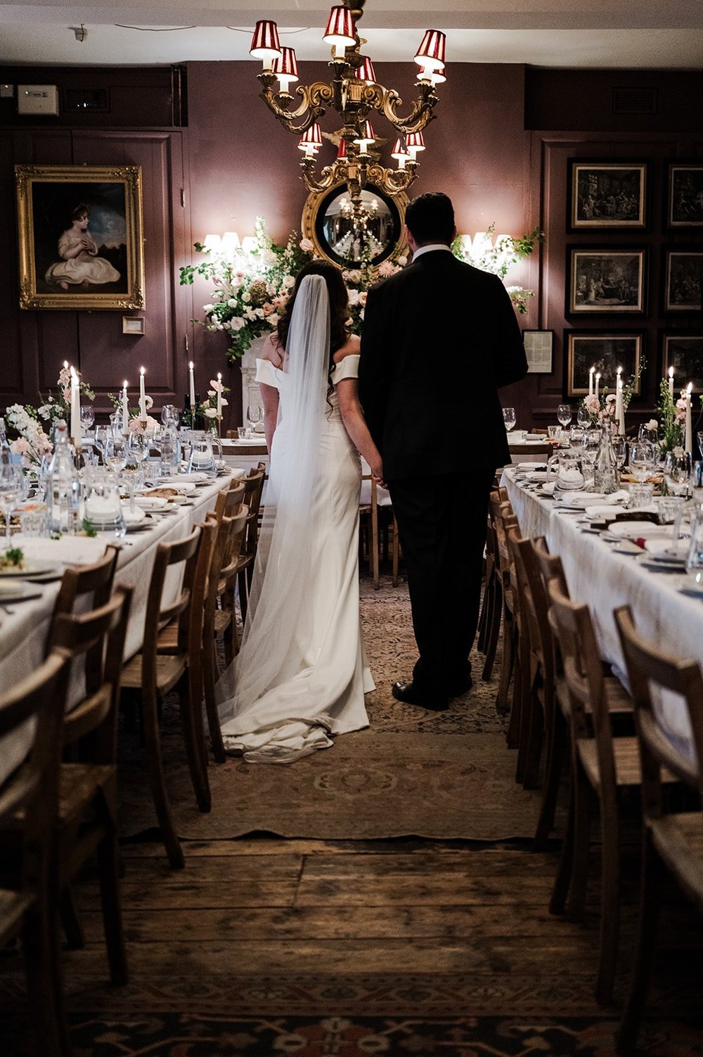 Chloe and Jon walking the length of the dining room at Brunswick House
