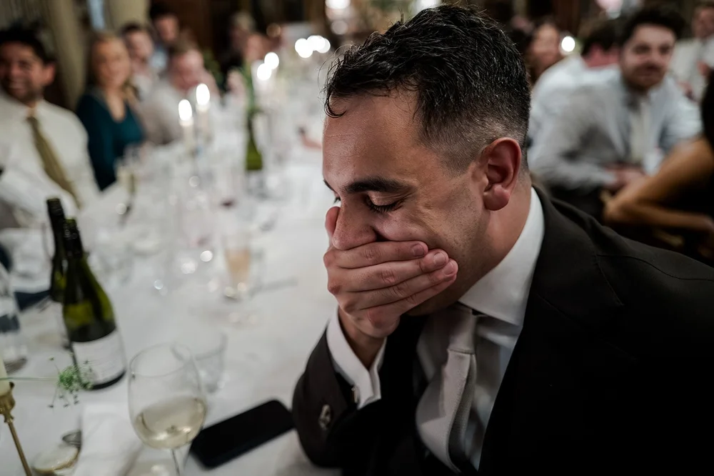 A guest laughing during the wedding speeches at Brunswick House
