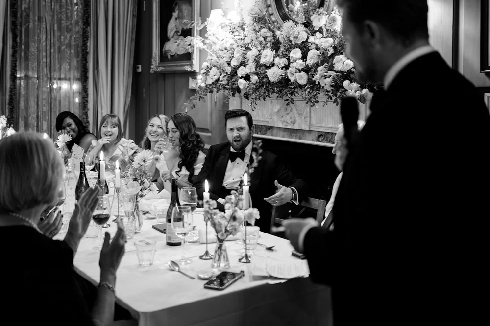 Black and white photograph of the top table during the speeches