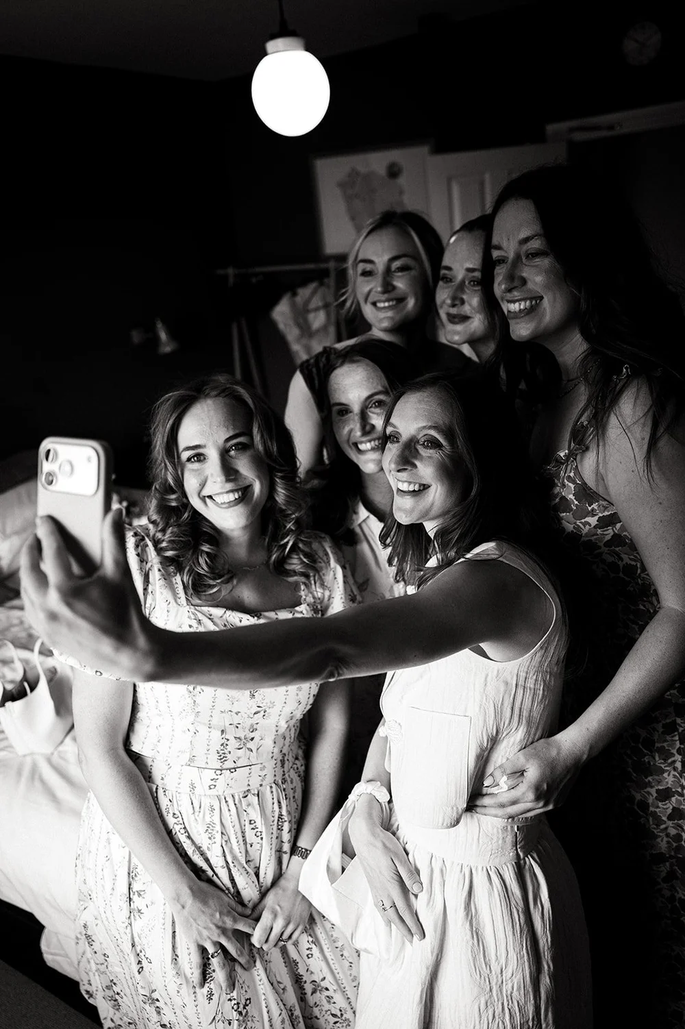 Ruby and her bridesmaids taking a photograph together before the ceremony