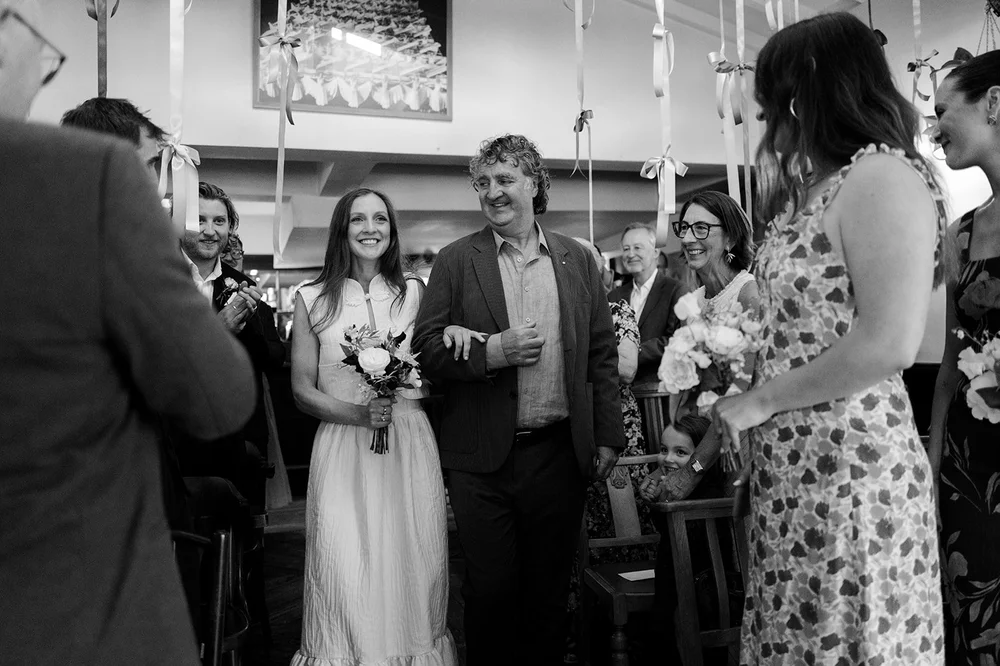Guests talking together in the pub before the ceremony