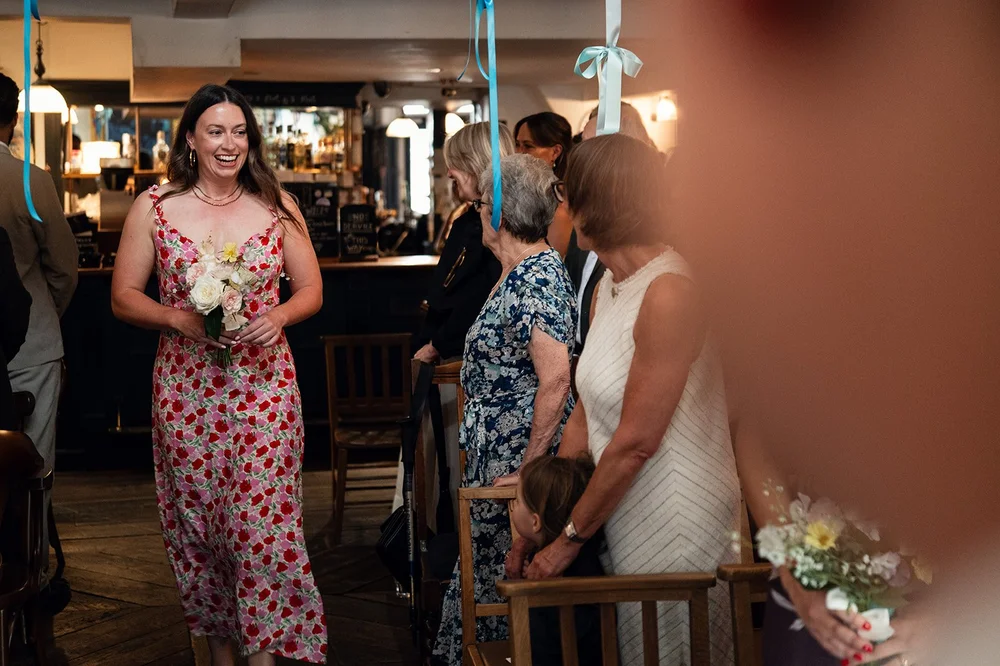 Ruby and her bridesmaids in the doorway at The Alma Tavern