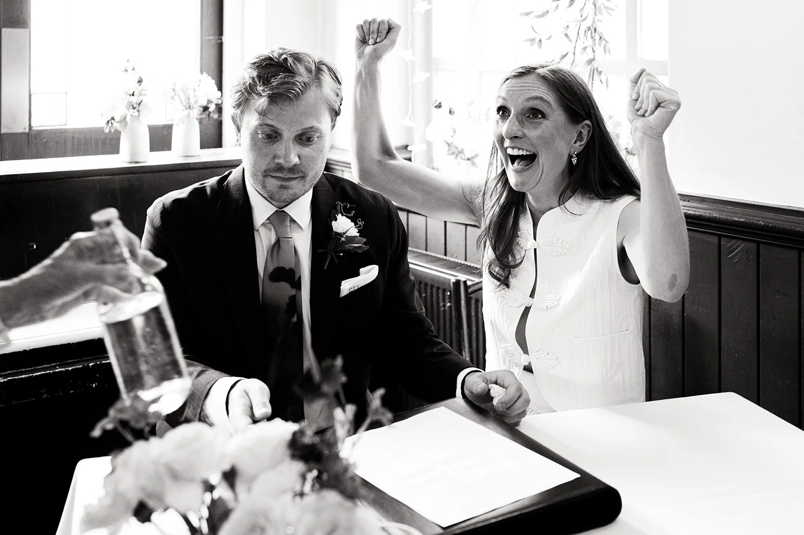 Patrick and Ruby celebrating as they sign the register at The Alma Tavern