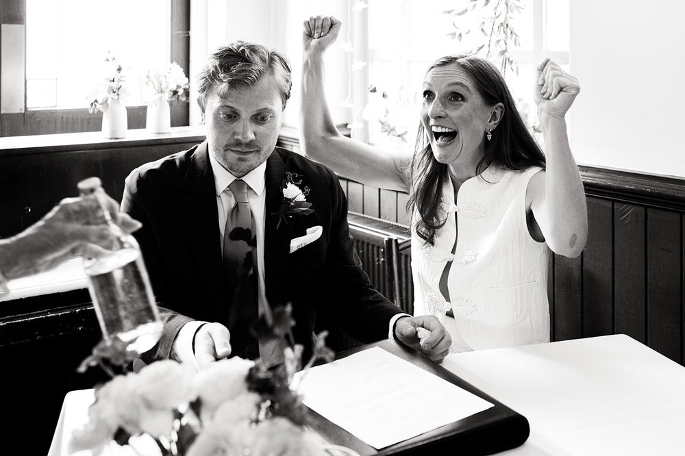Patrick and Ruby celebrating as they sign the register at The Alma Tavern